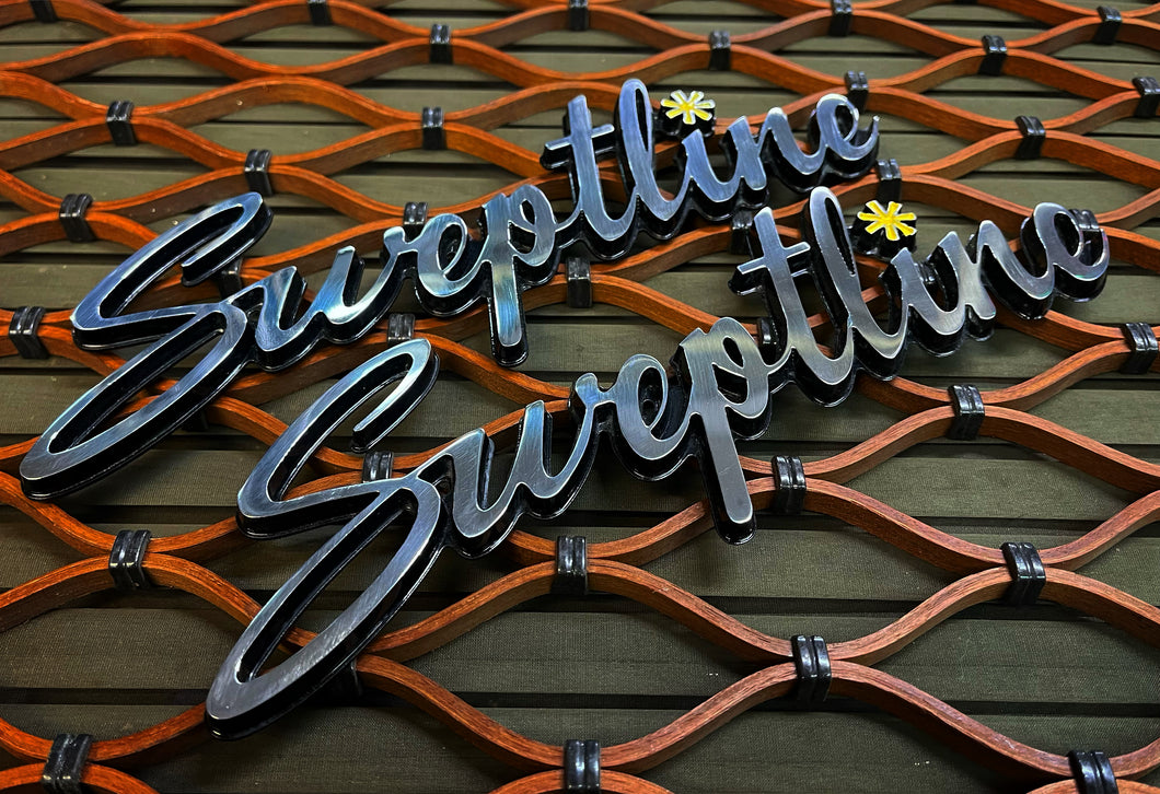 Sweptline emblems in Swinger style